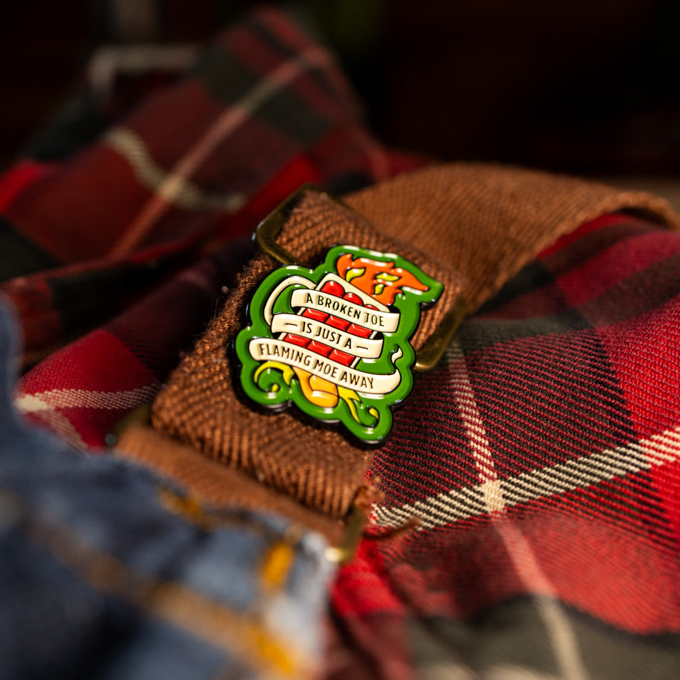 "A Broken Toe is Just a Flaming Moe Away" Pin