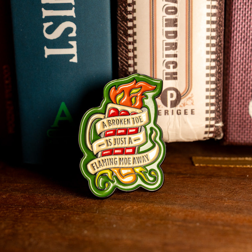 "A Broken Toe is Just a Flaming Moe Away" Pin